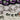 Keychains shaped like a bat and a white ghost with green eyes on a white background.