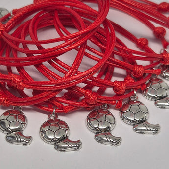 Red waxed cord bracelets with silver football charm pendants, displayed in sets of six or twelve.