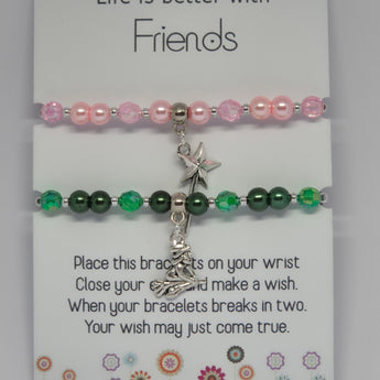 pink and green wicked witch bracelets on a card
